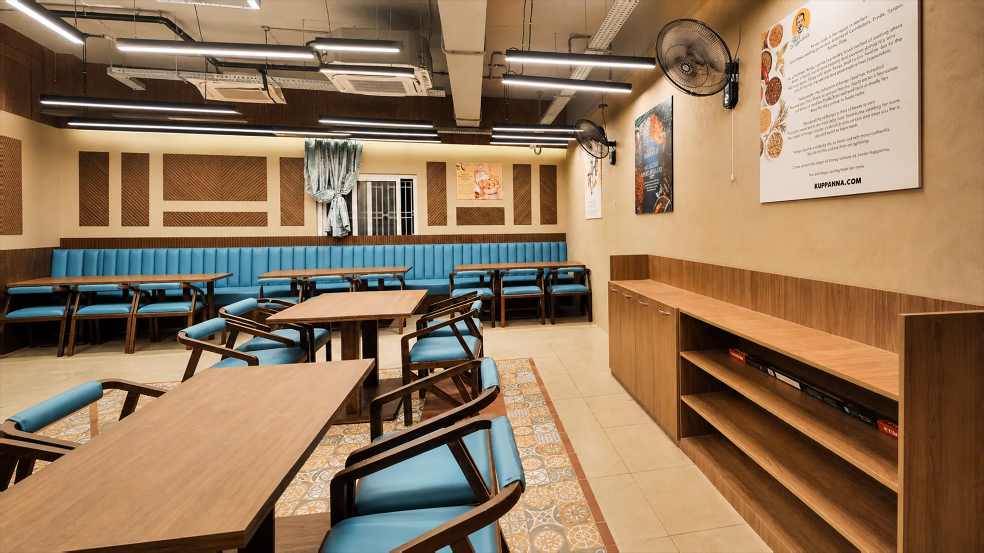 Dining room with perimeter bench seating and central timber tables.