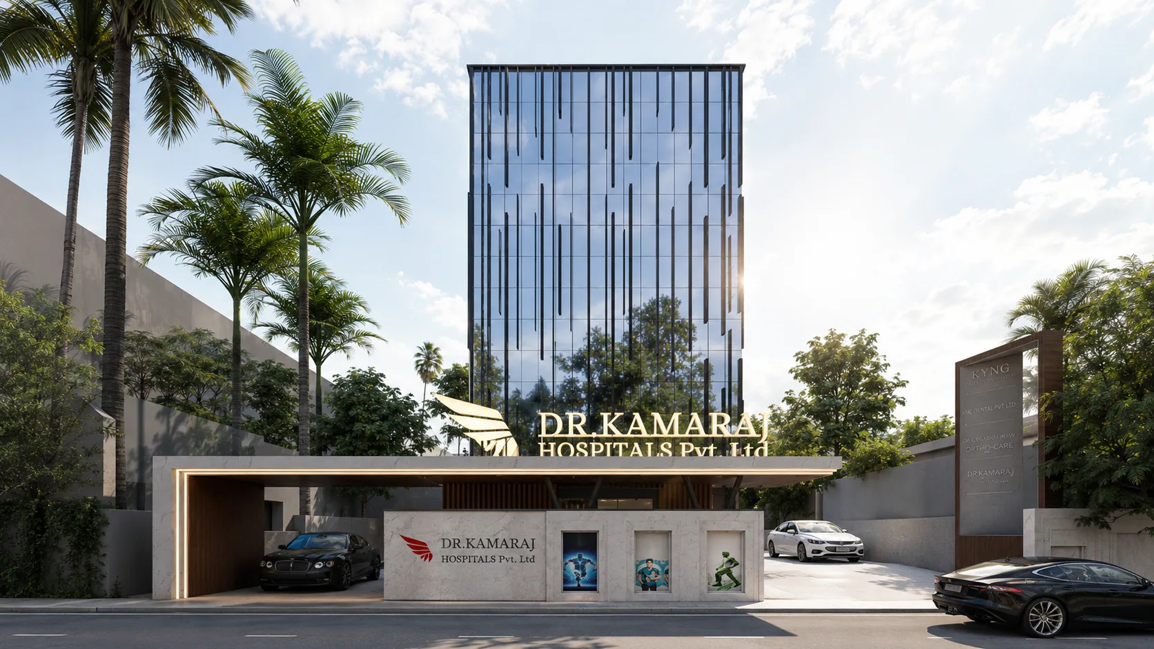Daylight view of Kamaraj Hospitals with a glazed tower and entrance canopy.