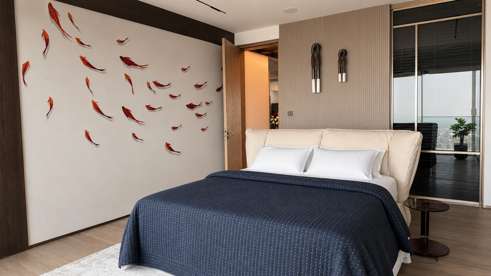 Bedroom with dark bedding, wall-mounted fish artwork and full-height windows.