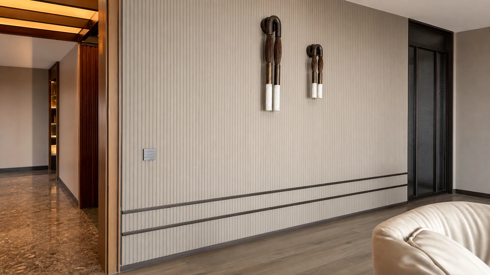 Bedroom wall detail with paired sconces beside a glazed opening.